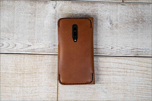 a brown leather case for a cell phone