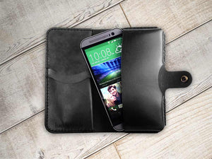 a cell phone sitting inside of a black case