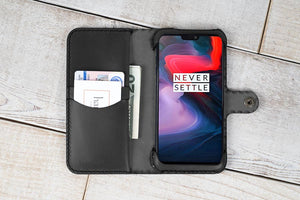 an iphone case with a wallet and a credit card